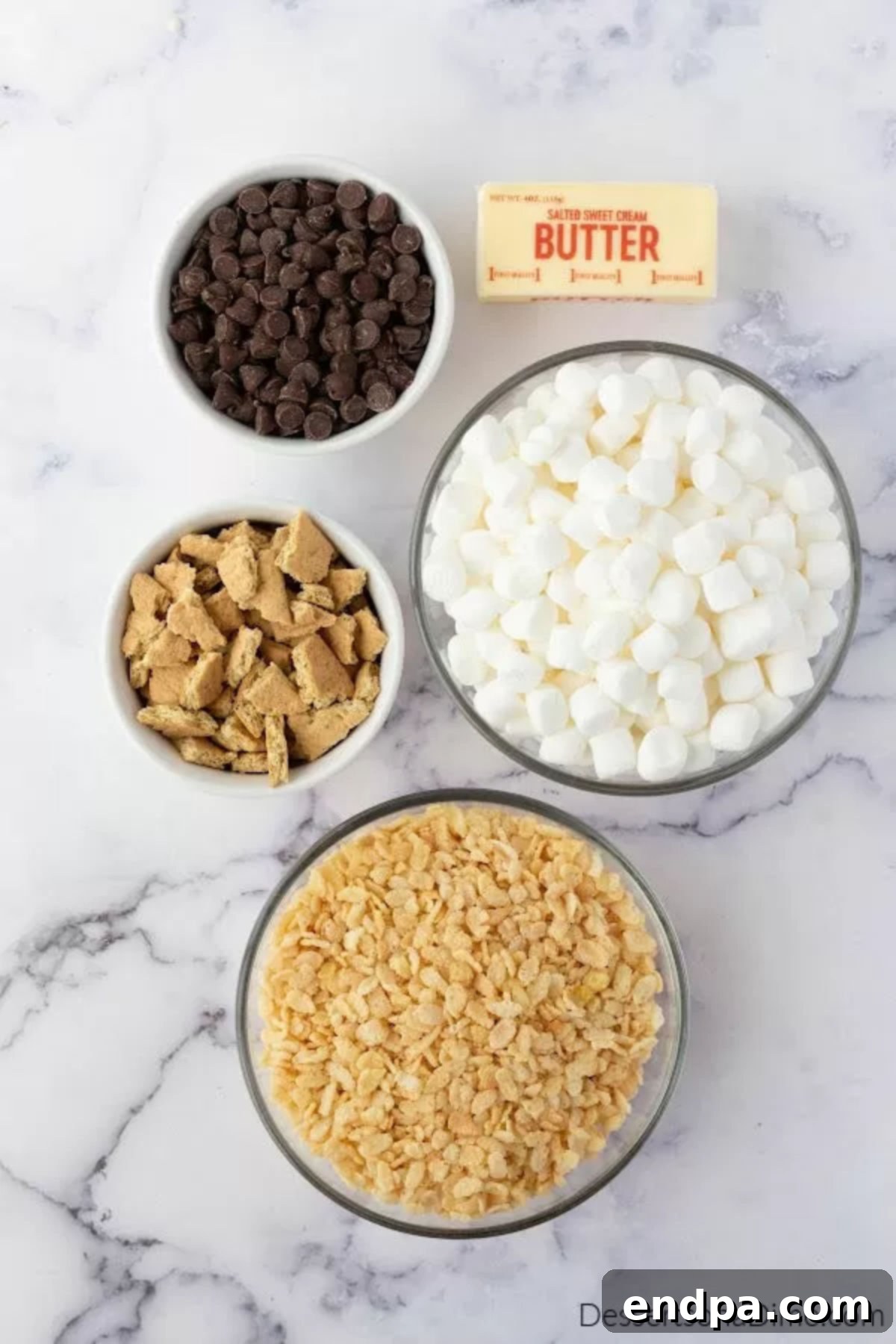 No-Bake S'mores Rice Krispie Treats 3 Ingredients for smore rice krispie treats - rice krispy cereal, mini marshmallows, and chocolate chips.