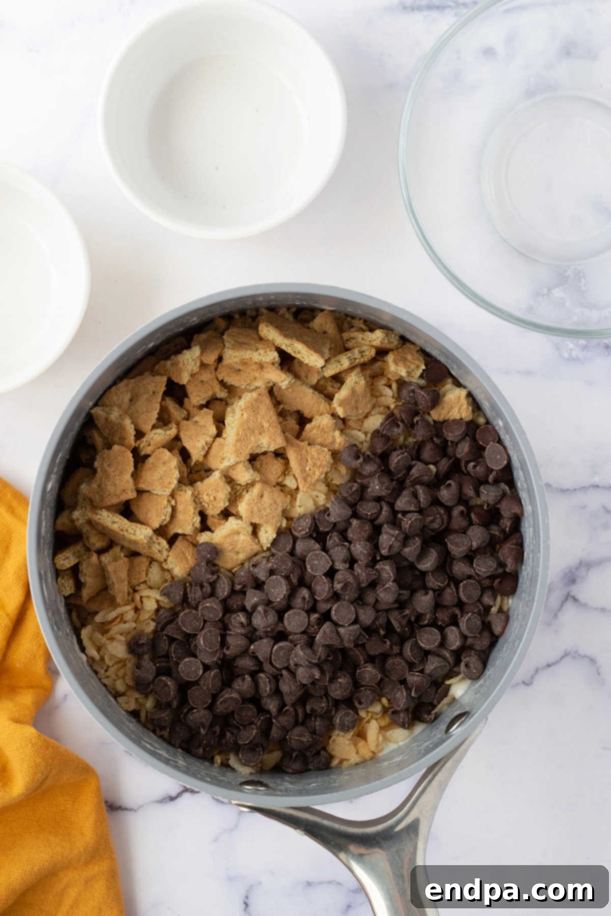 No-Bake S'mores Rice Krispie Treats 5 Cereal and chocolate chips folded into mixture.