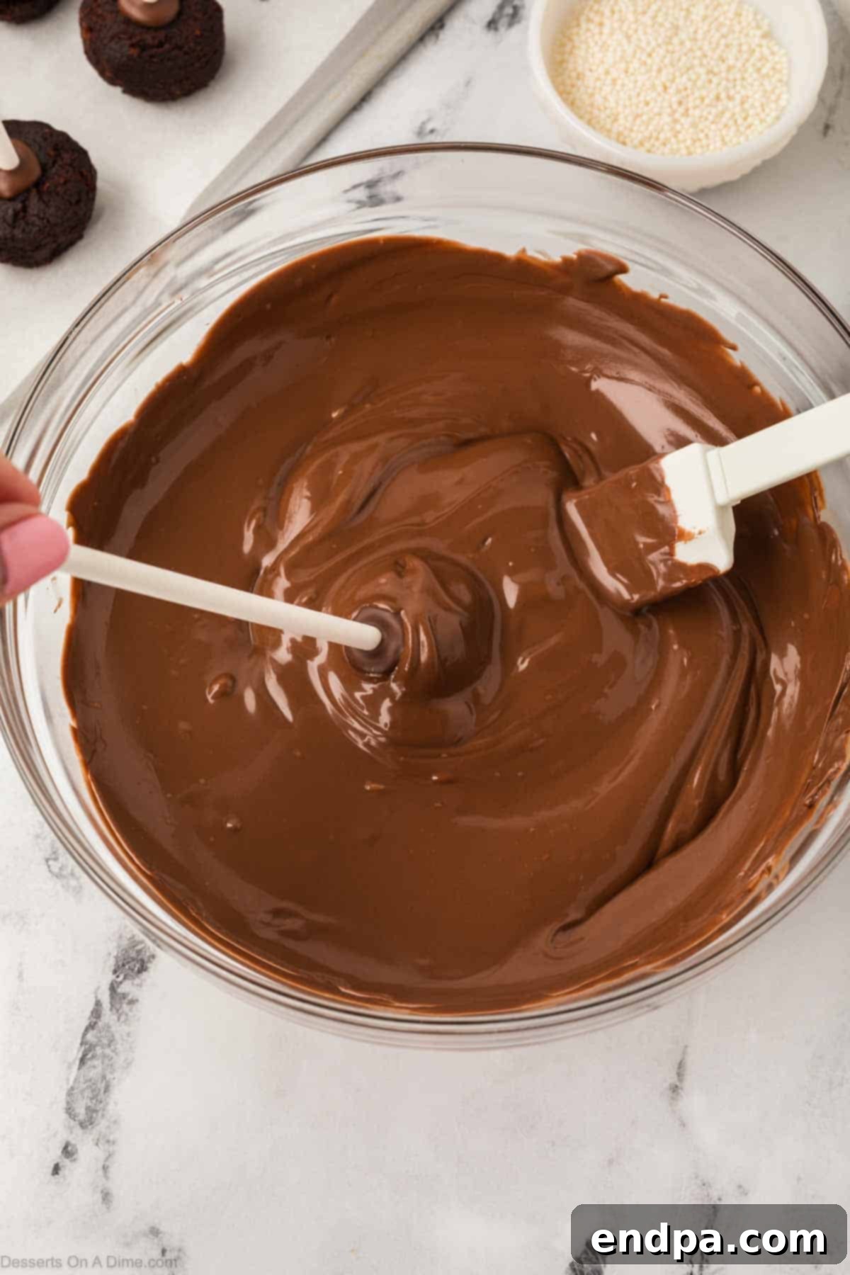 Melted chocolate candy melts in a bowl, ready for dipping.