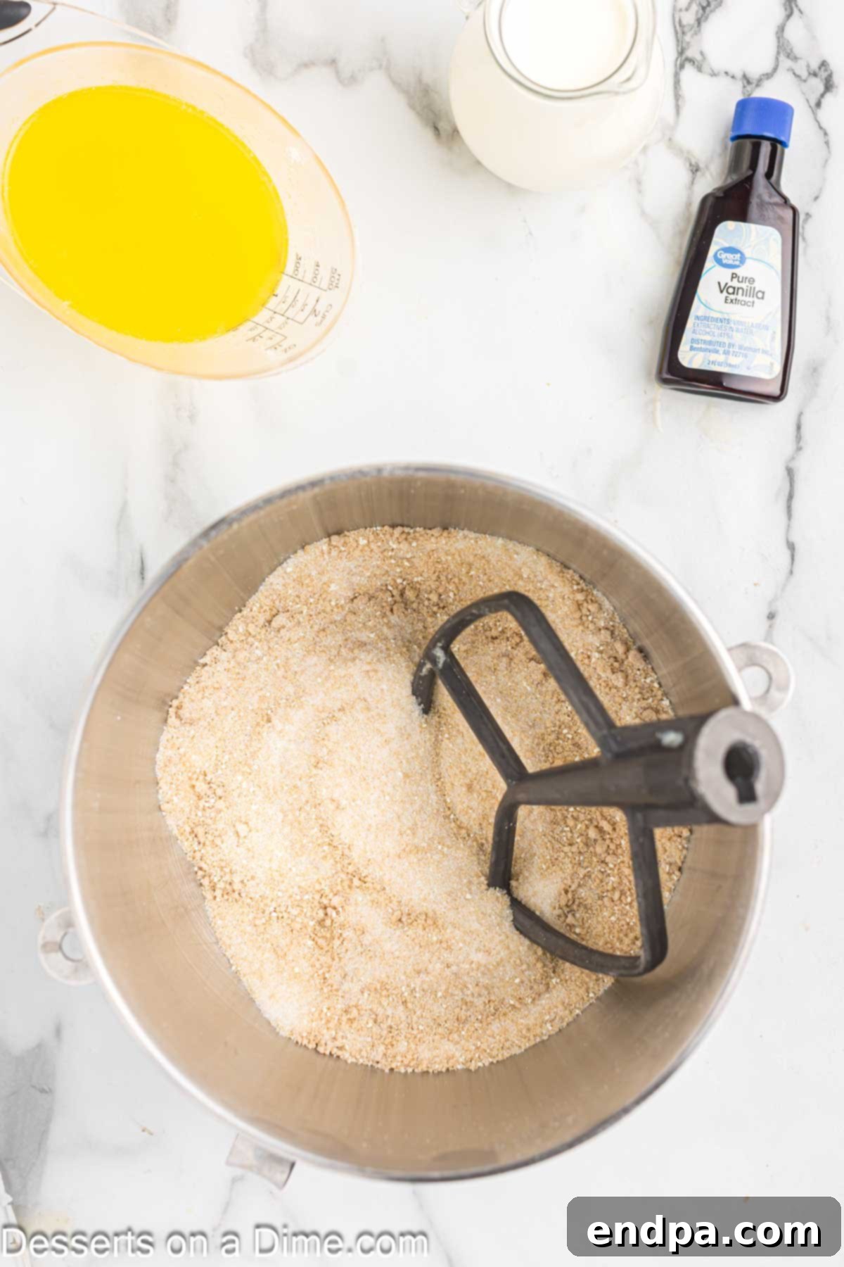 Golden Butter Crunch Pie 13 Mixing granulated sugar, brown sugar, dry milk powder, corn powder, and salt in a bowl with a paddle attachment.