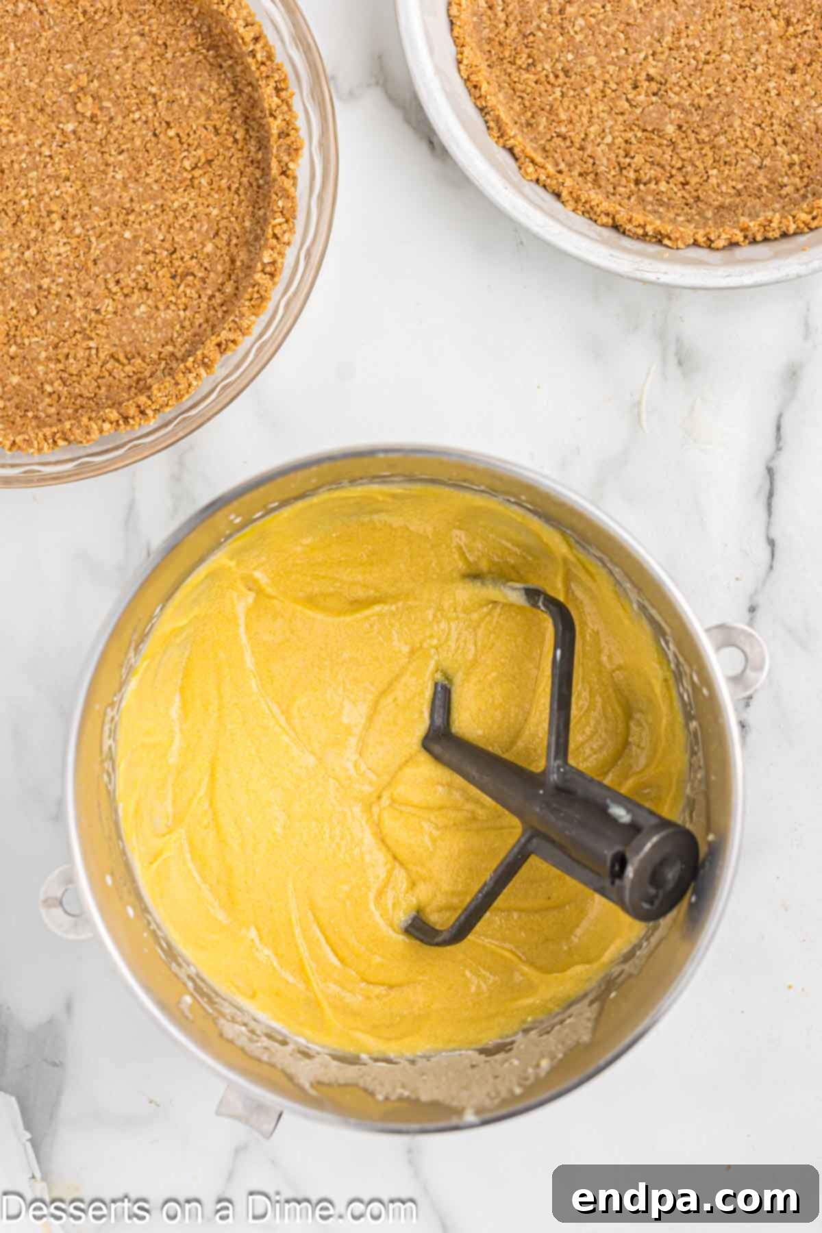 Golden Butter Crunch Pie 16 Adding egg yolks to the pie filling mixture in a stand mixer.