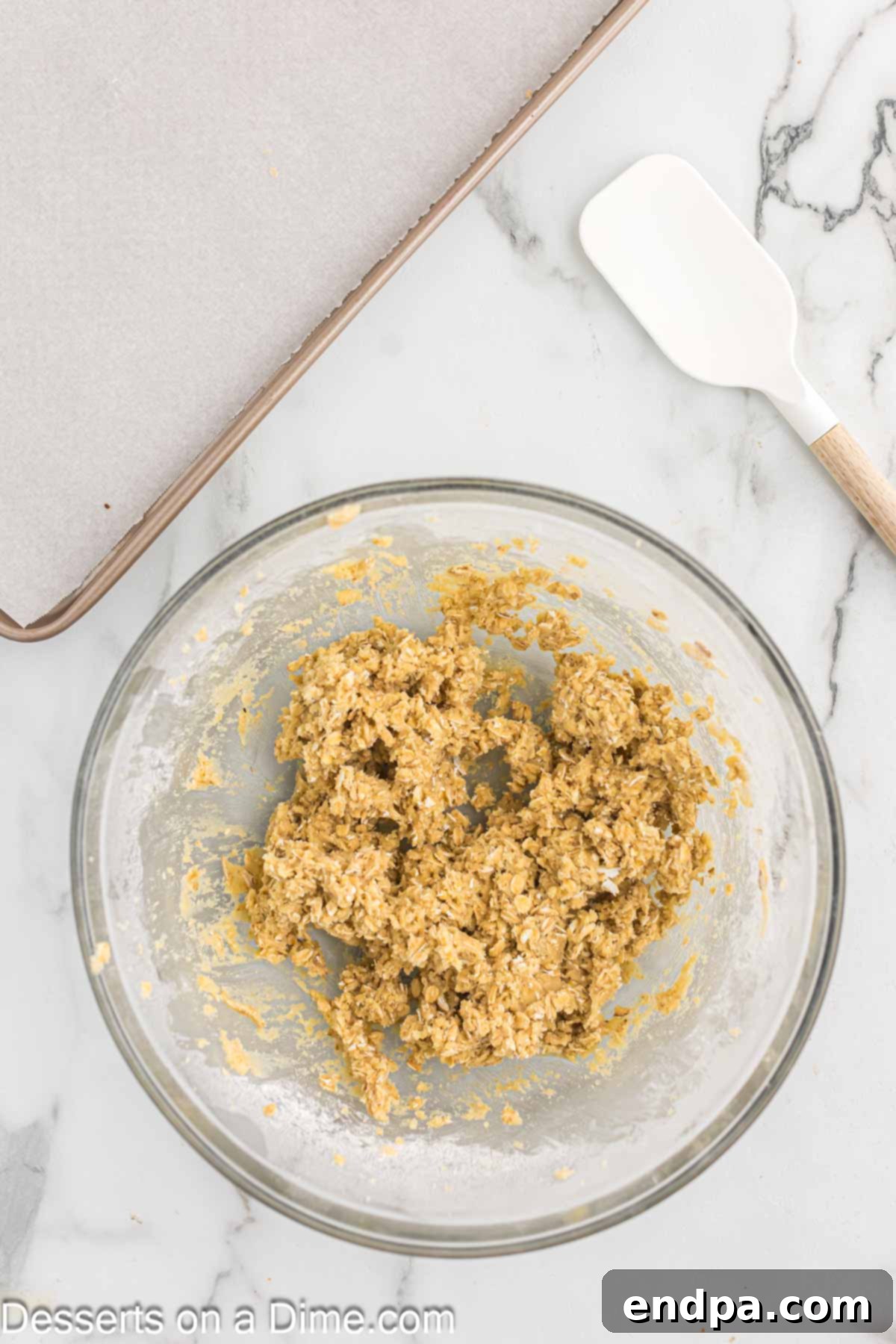Golden Butter Crunch Pie 6 Adding flour, oats, baking powder, baking soda, and salt to the wet ingredients in a mixing bowl.