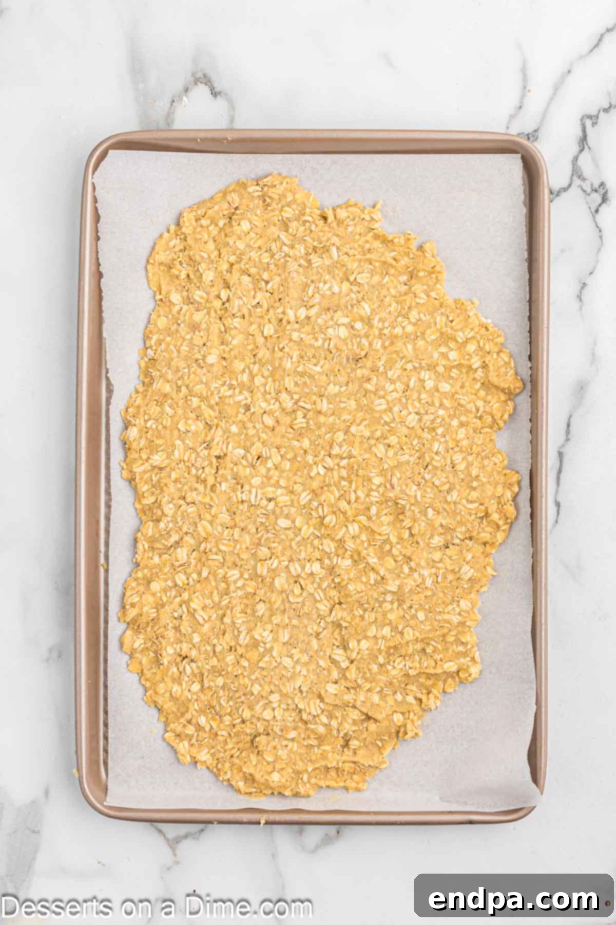 Golden Butter Crunch Pie 7 Spreading the oat cookie dough evenly onto a parchment-lined baking sheet.