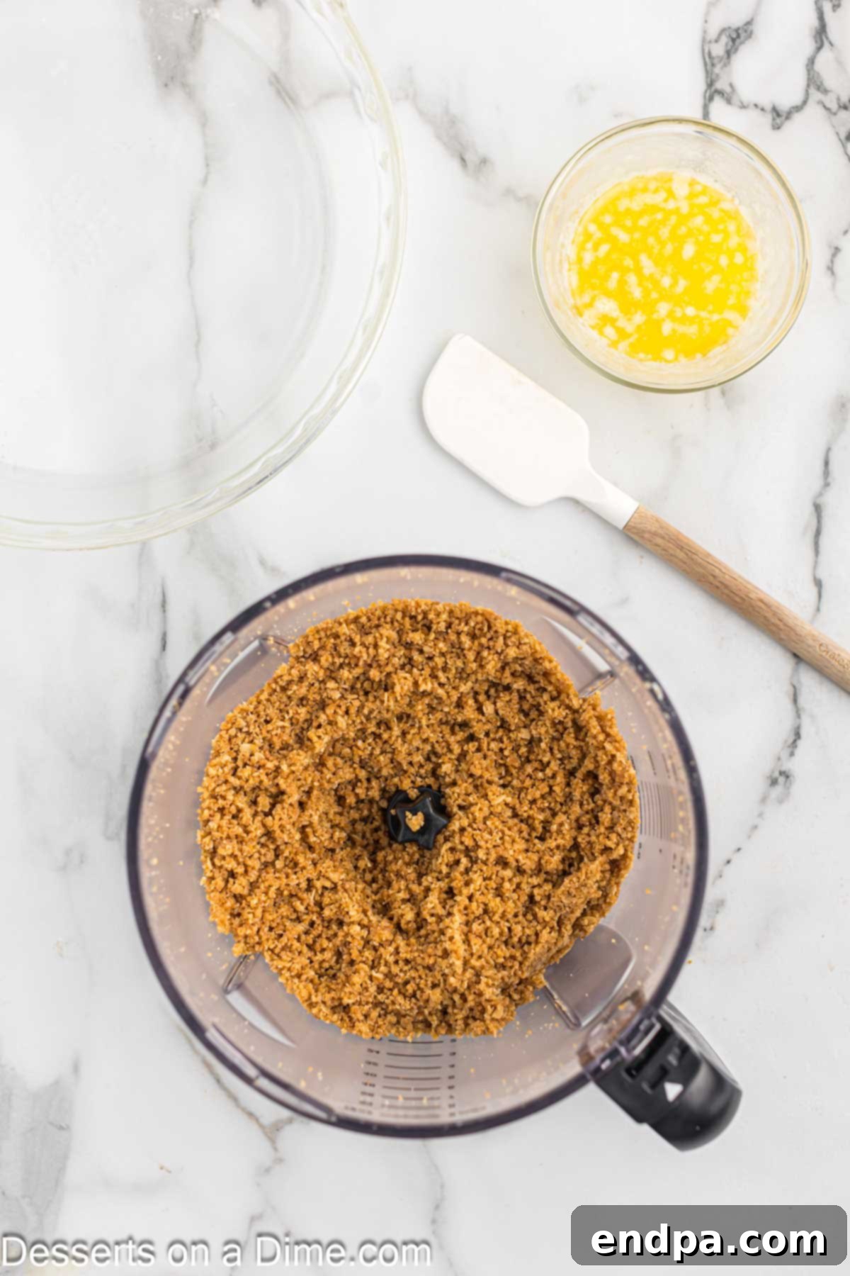 Golden Butter Crunch Pie 10 Melted butter being poured over the crushed oat cookie and sugar mixture in a mixing bowl.
