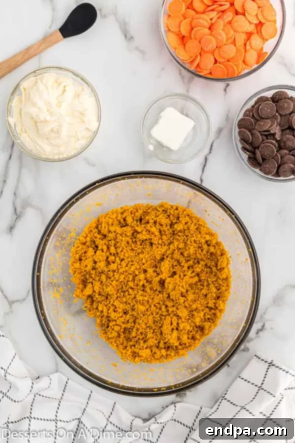 Crumble cake in a large mixing bowl, ready for frosting.