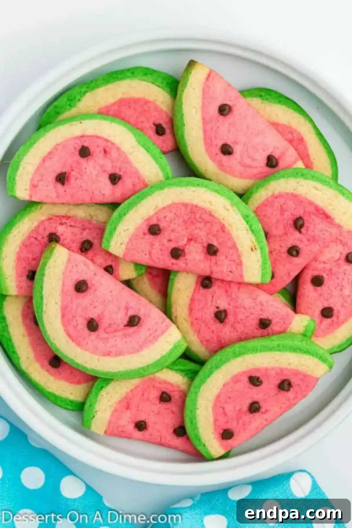 Summer Melon Bites 2 Watermelon cookies artfully arranged on a pristine white plate.