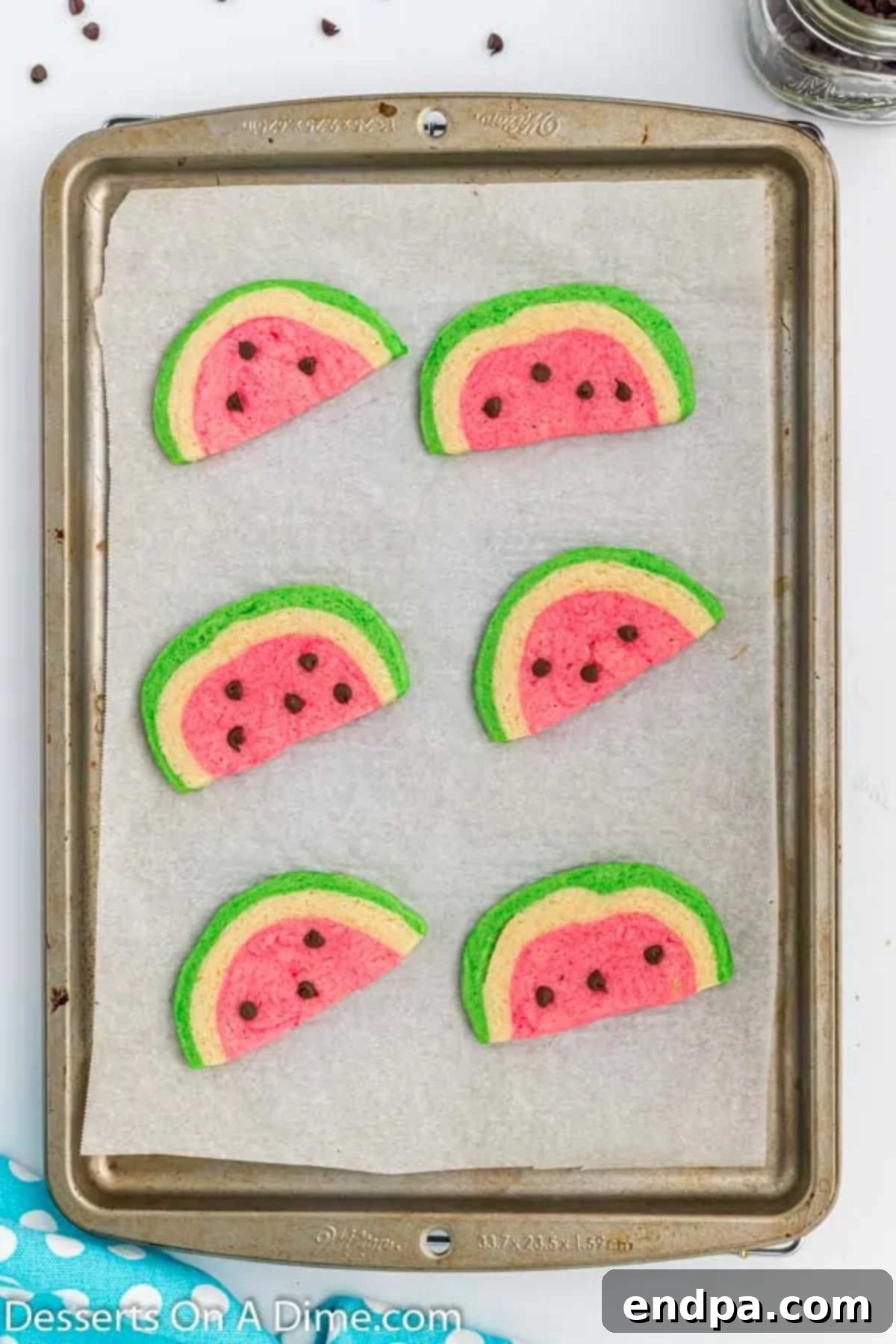 Summer Melon Bites 11 Freshly baked watermelon cookies cooling on a wire rack.