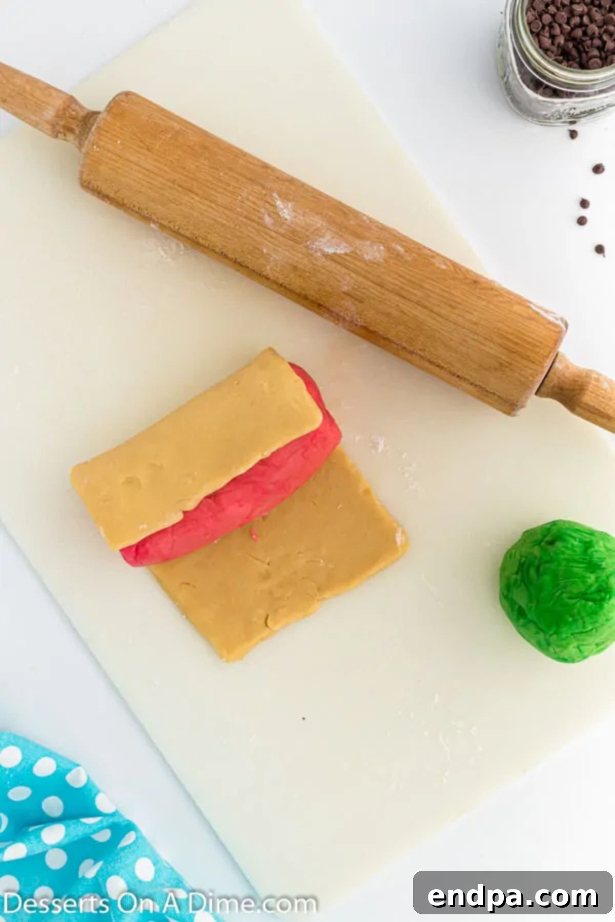 Summer Melon Bites 7 The red/pink dough rolled into a neat log and wrapped in plastic wrap.