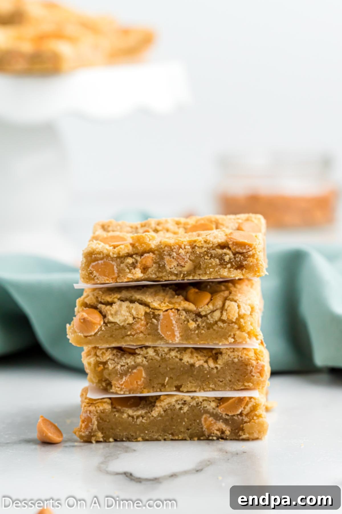 Irresistible Butterscotch Squares 2 Stacked chewy butterscotch bars, showing their rich golden color and soft texture.
