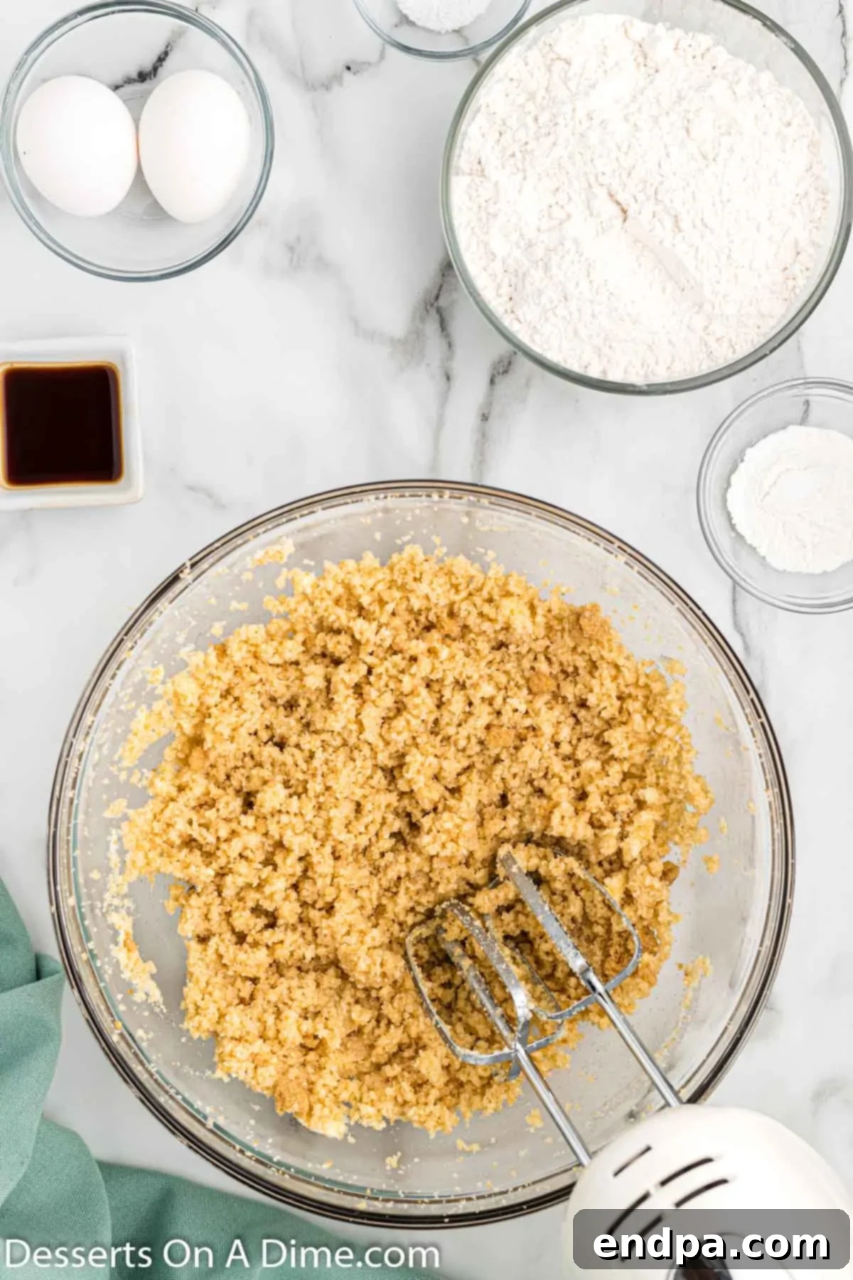 Irresistible Butterscotch Squares 4 Softened butter and brown and granulated sugars being creamed together in a mixing bowl.