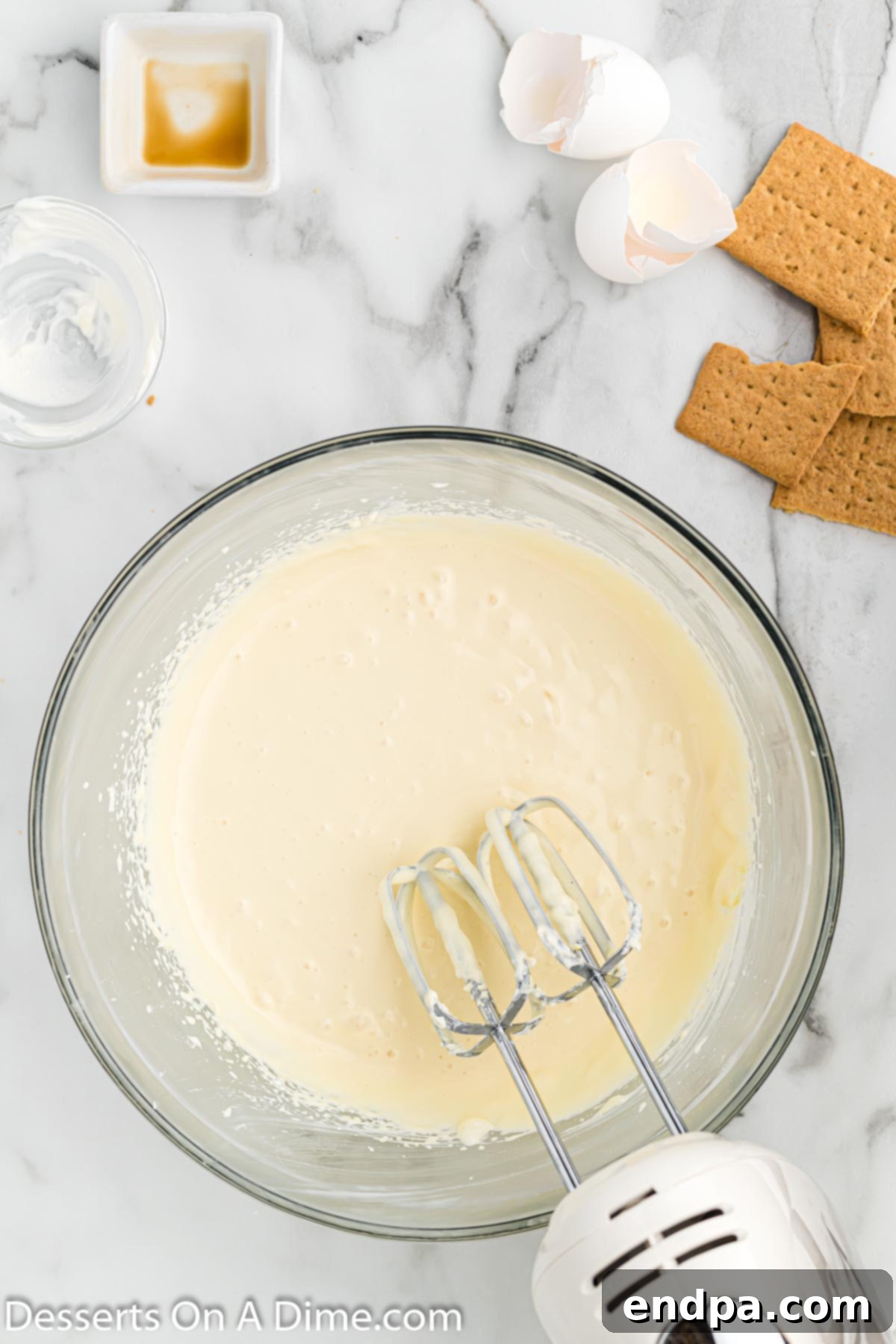 All cheesecake ingredients combined and mixed to a creamy consistency.