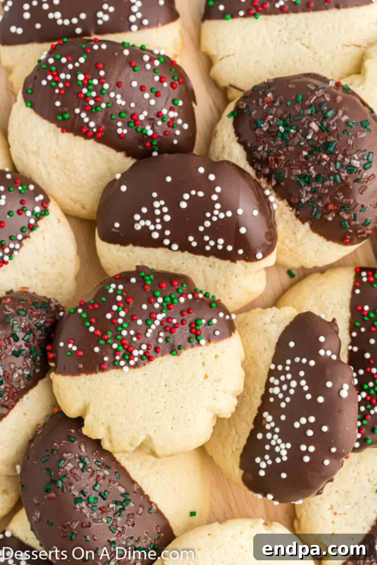 Chocolate dipped sugar cookies in a pile. 