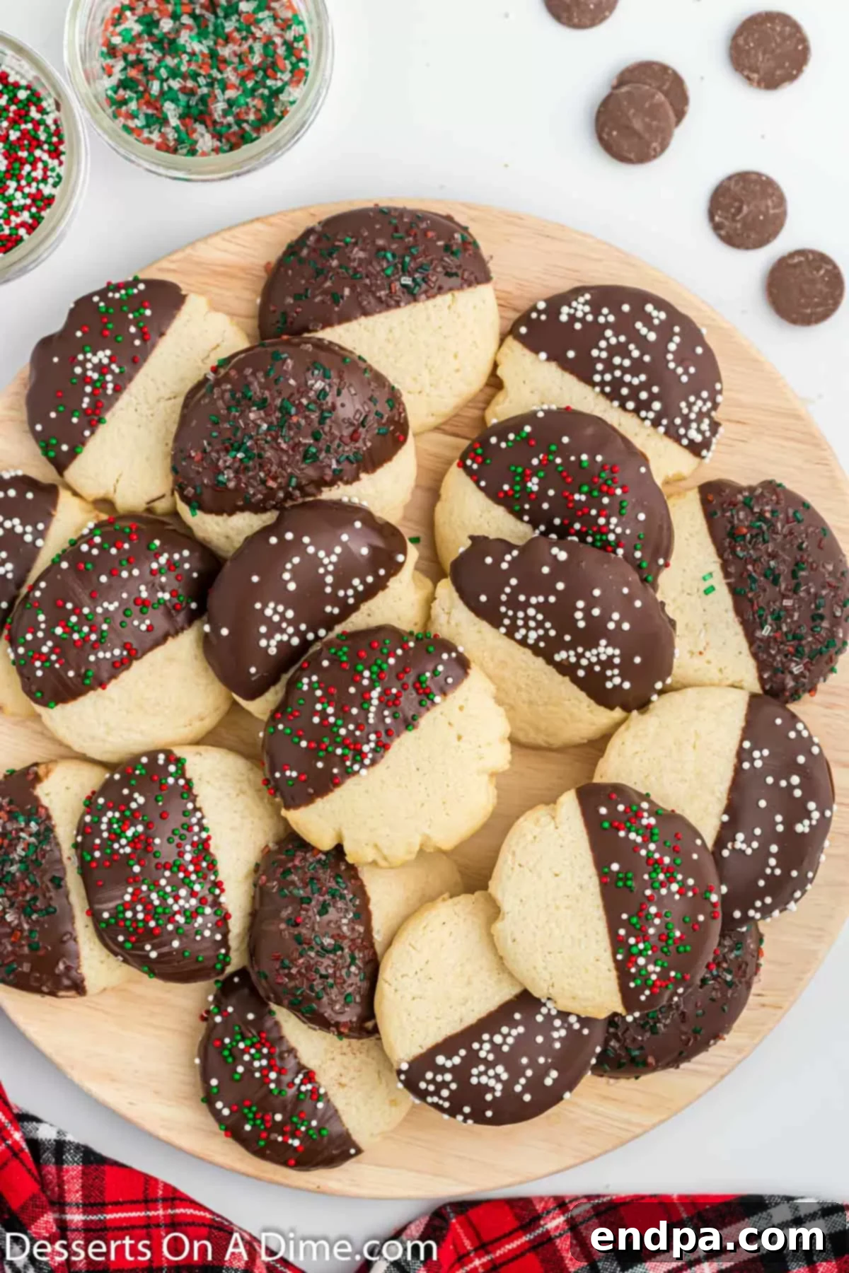 Chocolate dipped sugar cookies on a platter. 
