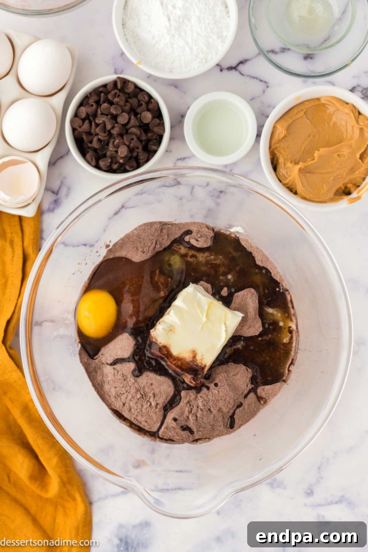 Ultimate Buckeye Brownie Delights 4 A mixing bowl containing the brownie mixture, showing a smooth, dark brown batter.