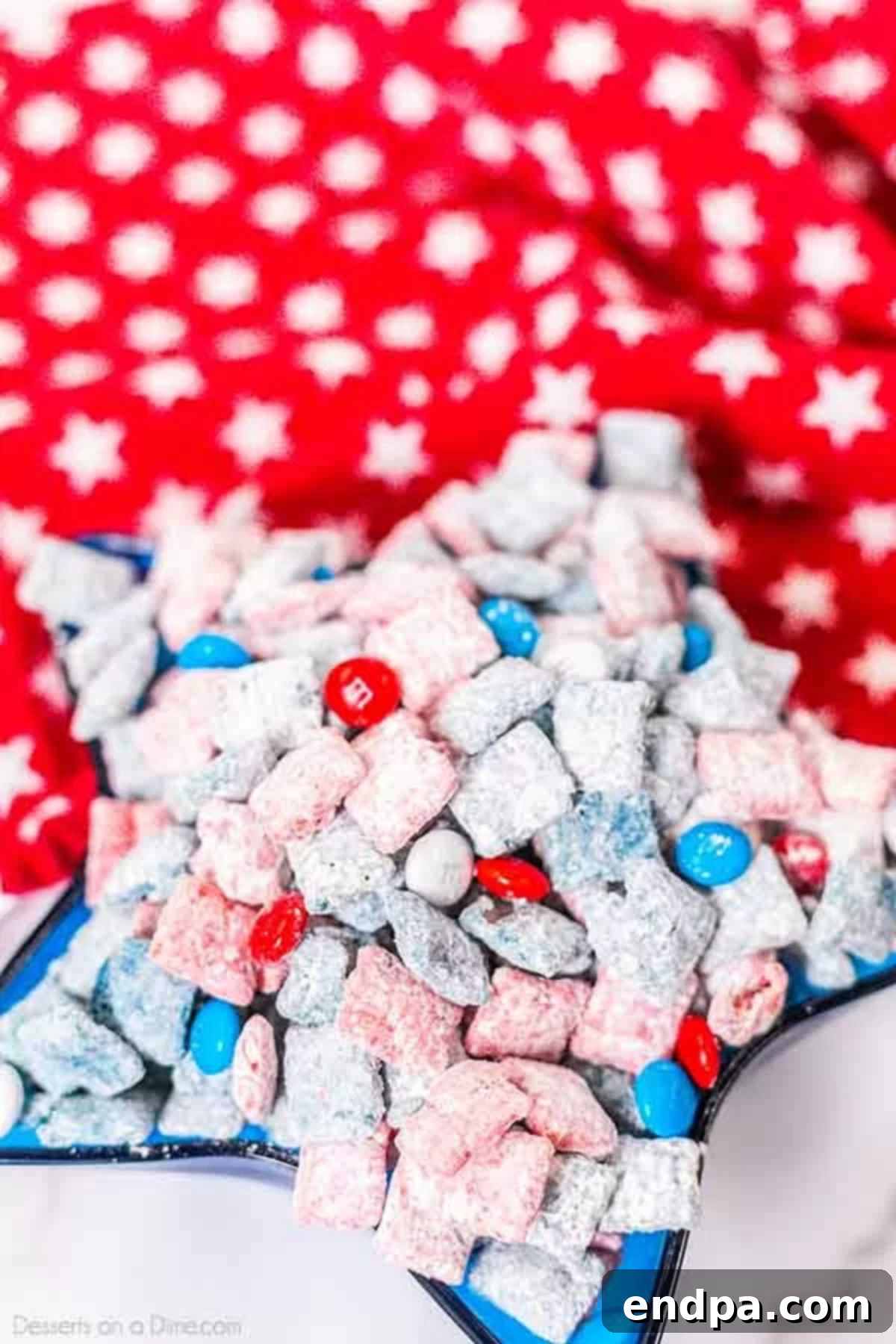 Patriotic Puppy Chow 2 Patriotic Muddy Buddies in a bowl, showcasing vibrant red, white, and blue colors.