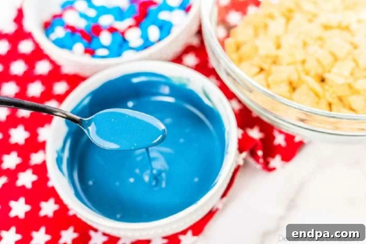 Patriotic Puppy Chow 4 Melted blue candy melts in a bowl, ready for coating cereal.