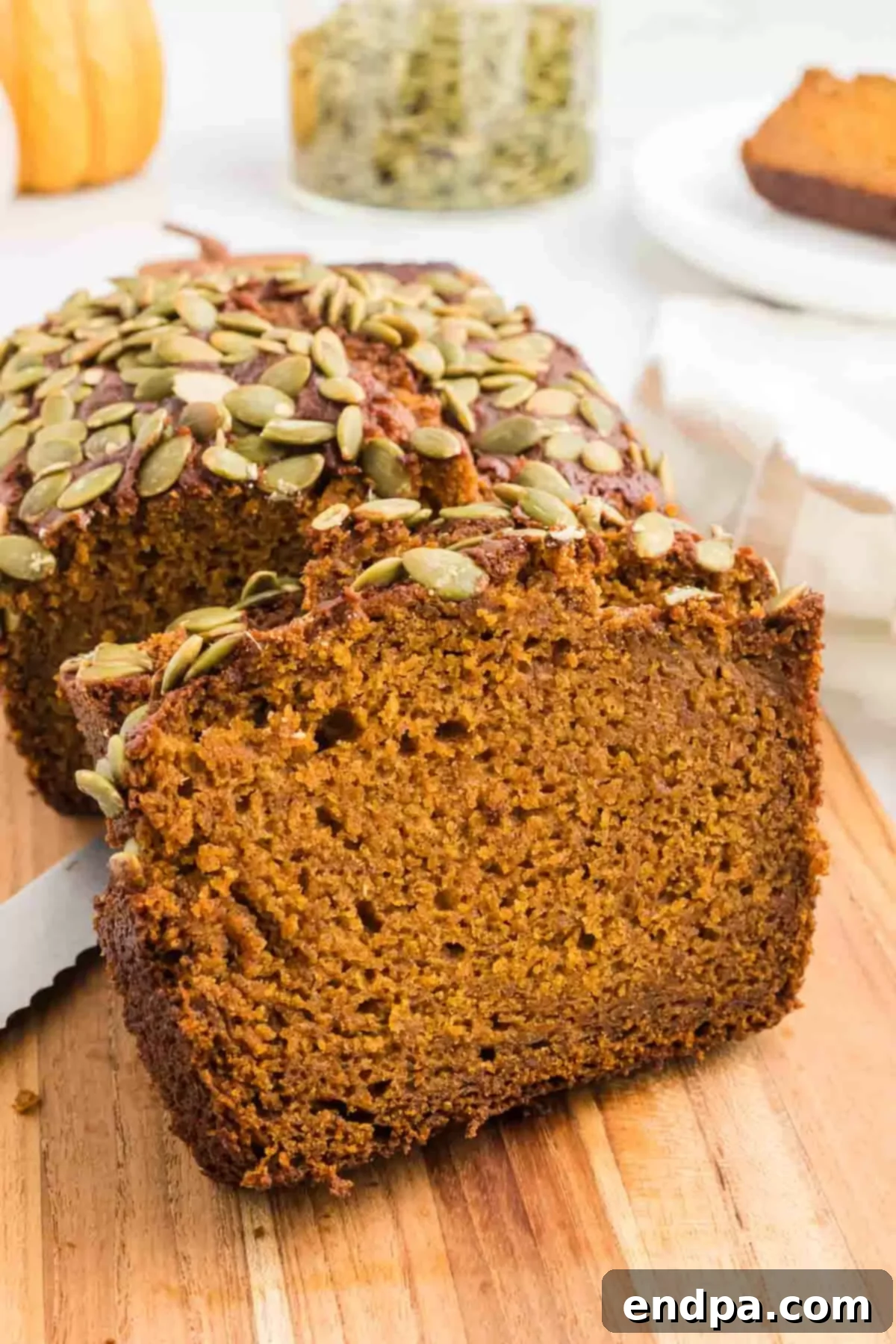 Starbucks Copycat Pumpkin Bread 2 Starbucks pumpkin bread on a cutting board, ready to be served.