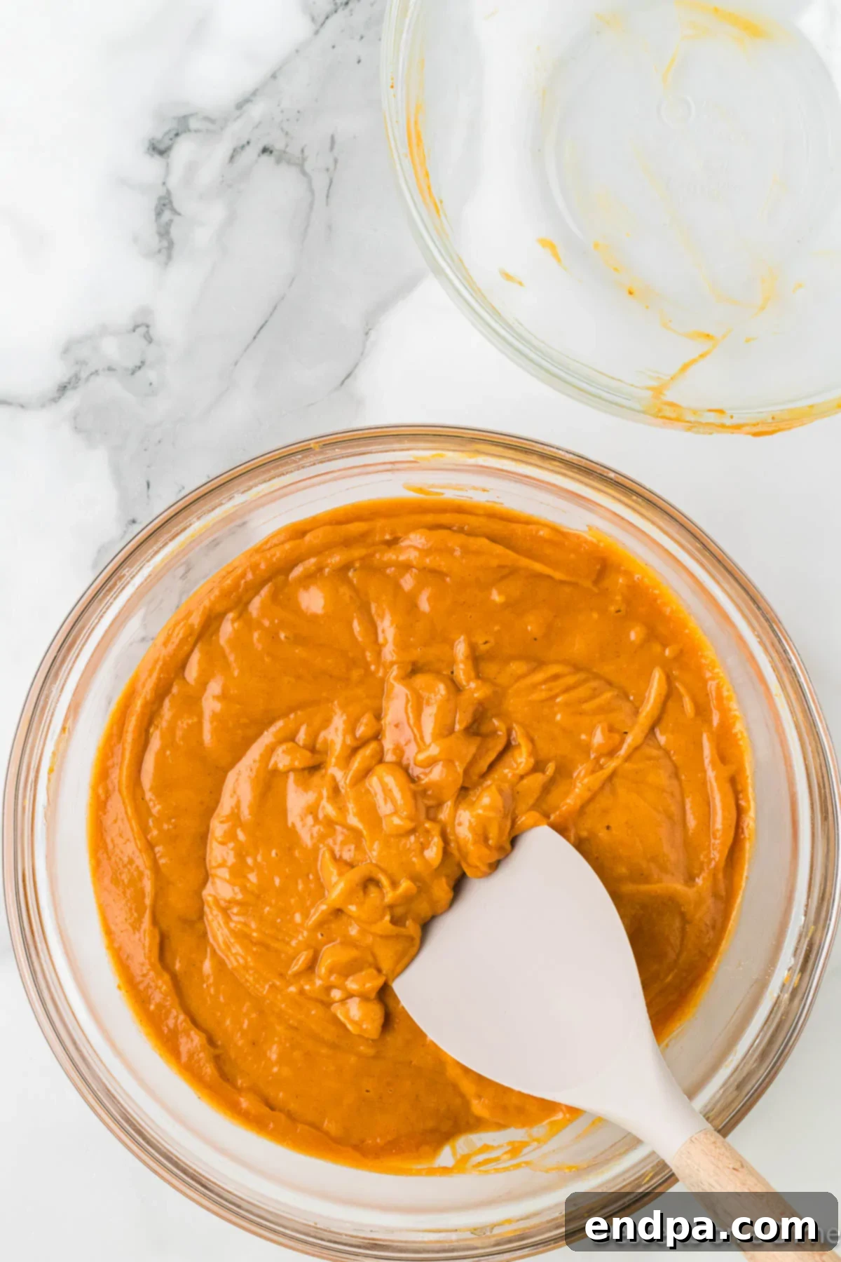 Starbucks Copycat Pumpkin Bread 6 Mixing bowl with wet ingredients and dry ingredients combined.