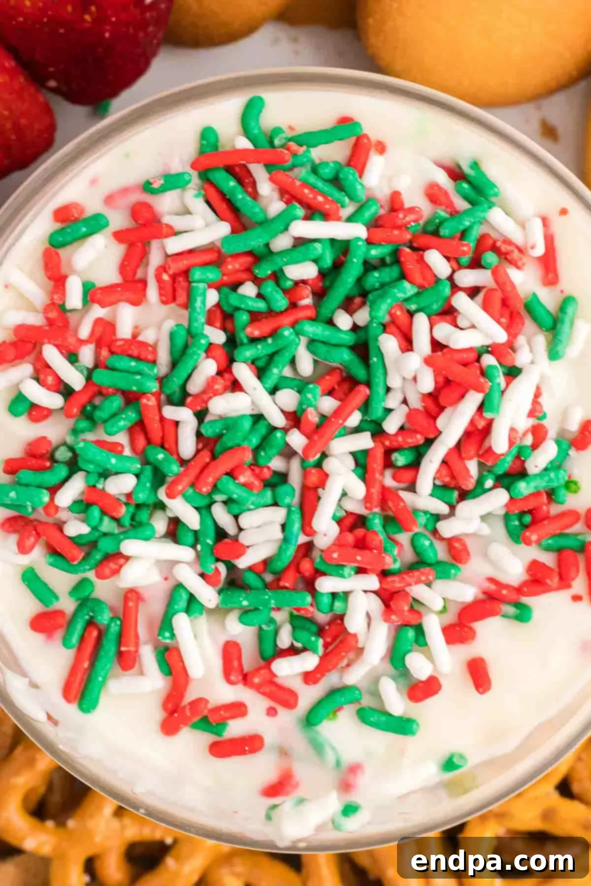 Santa's Favorite Cookie Dip 2 Christmas cookie dip with sprinkles in serving dish, ready to be enjoyed.