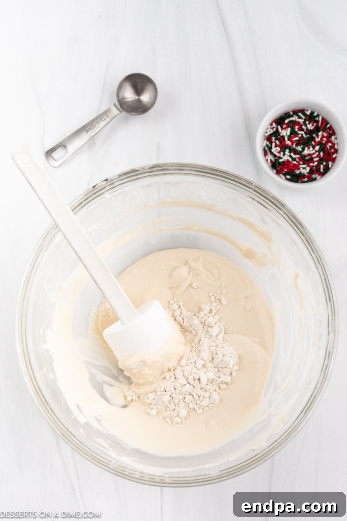 Santa's Favorite Cookie Dip 4 Step 1: Blending butter, cream cheese, and powdered sugar until light and fluffy.