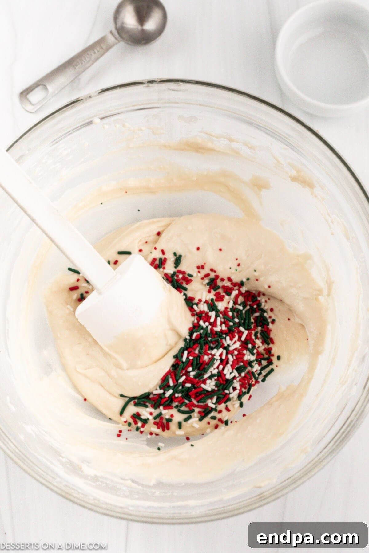 Santa's Favorite Cookie Dip 5 Step 2: Mixing in the flour and vanilla extract.