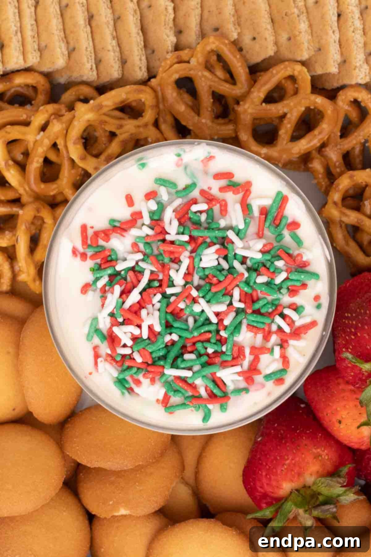 Santa's Favorite Cookie Dip 7 Step 4: Serving the chilled Christmas cookie dip with extra sprinkles and dippers.