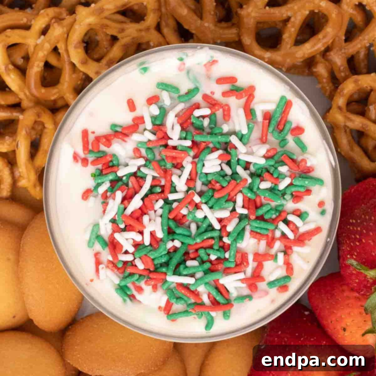 Santa's Favorite Cookie Dip 8 Delicious Christmas Cookie Dip garnished with festive sprinkles.