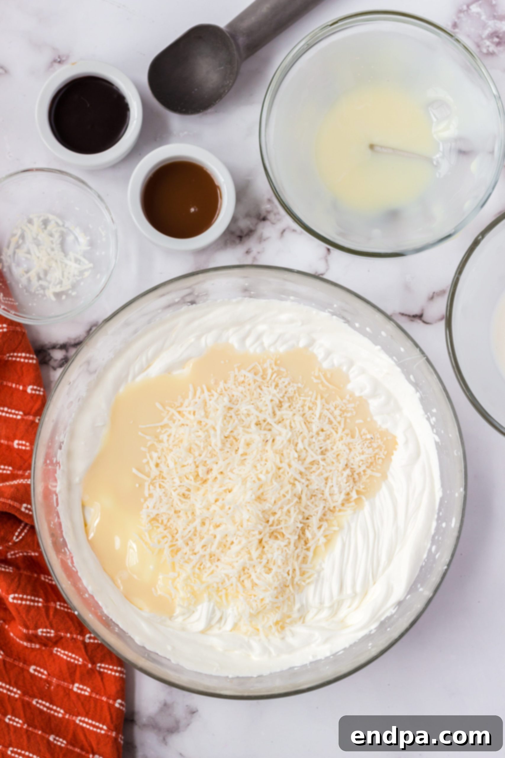 Sweetened condensed milk folded into whipped cream.