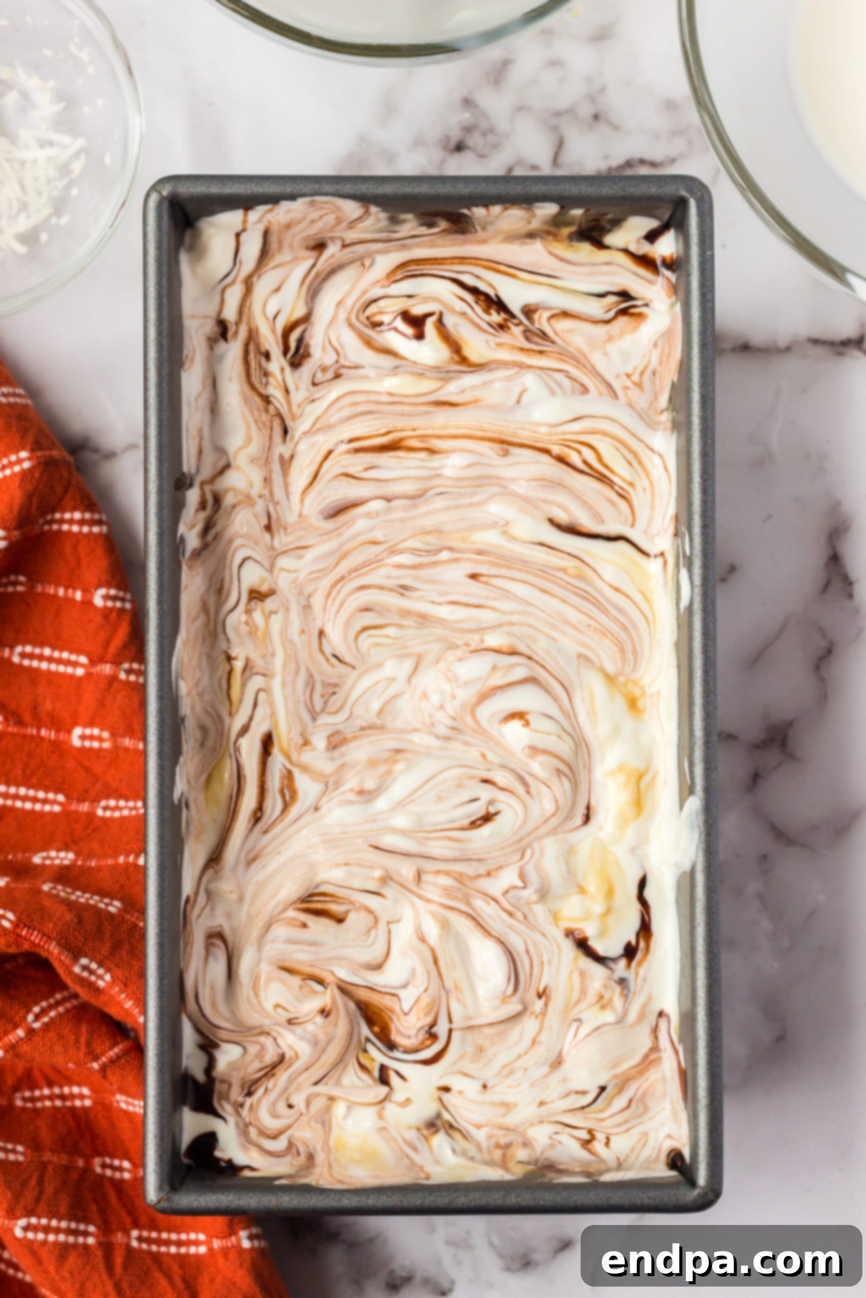 Ice cream mixture poured into loaf pan.