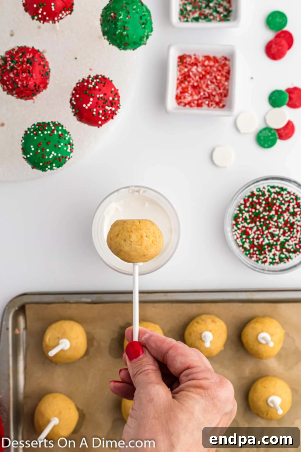 A cake pop ready for dipping into melted candy.