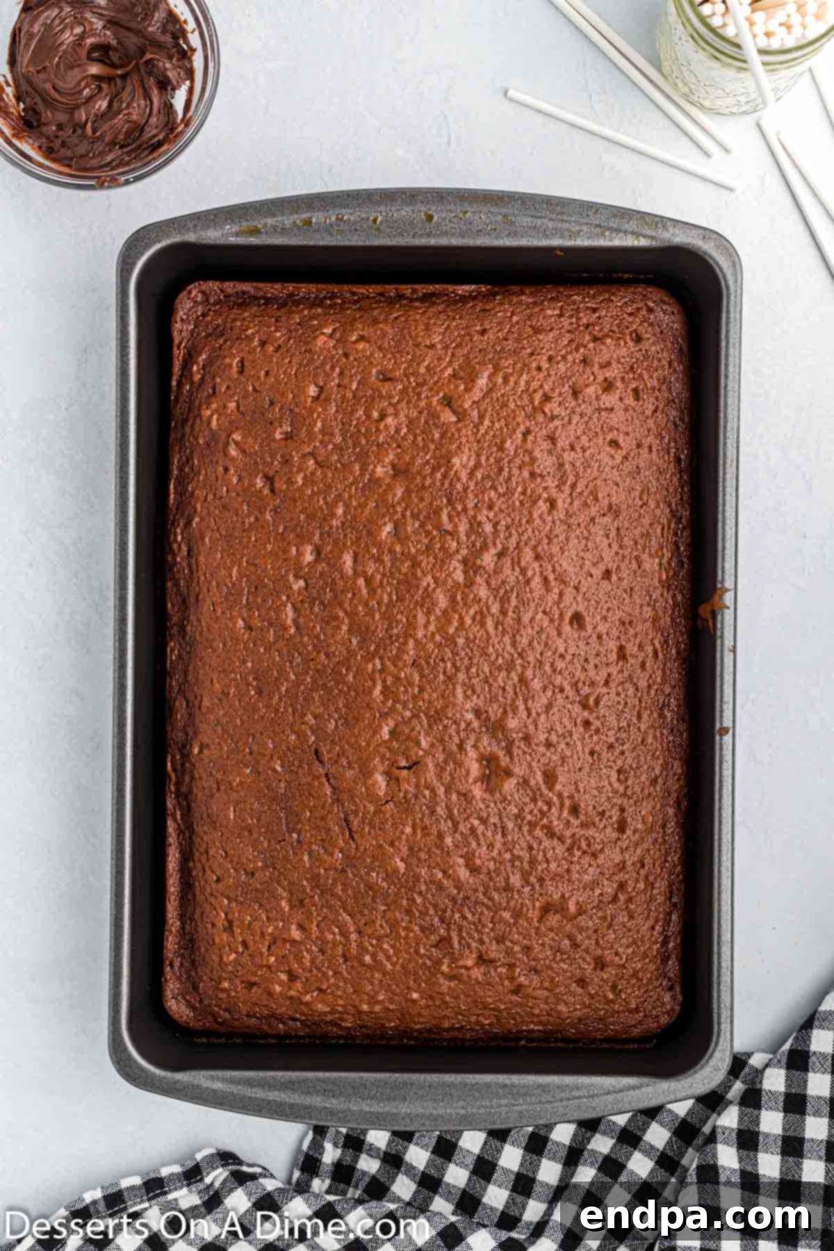 Spooky Sweet Halloween Cake Pops 4 Baked chocolate cake cooling in a 9x13 inch pan.