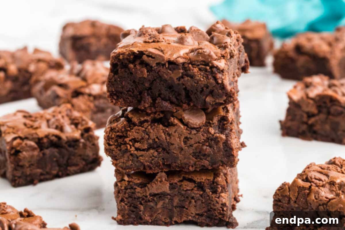 Close-up of a stack of Starbucks brownies, showcasing their rich, dark color and dense texture.