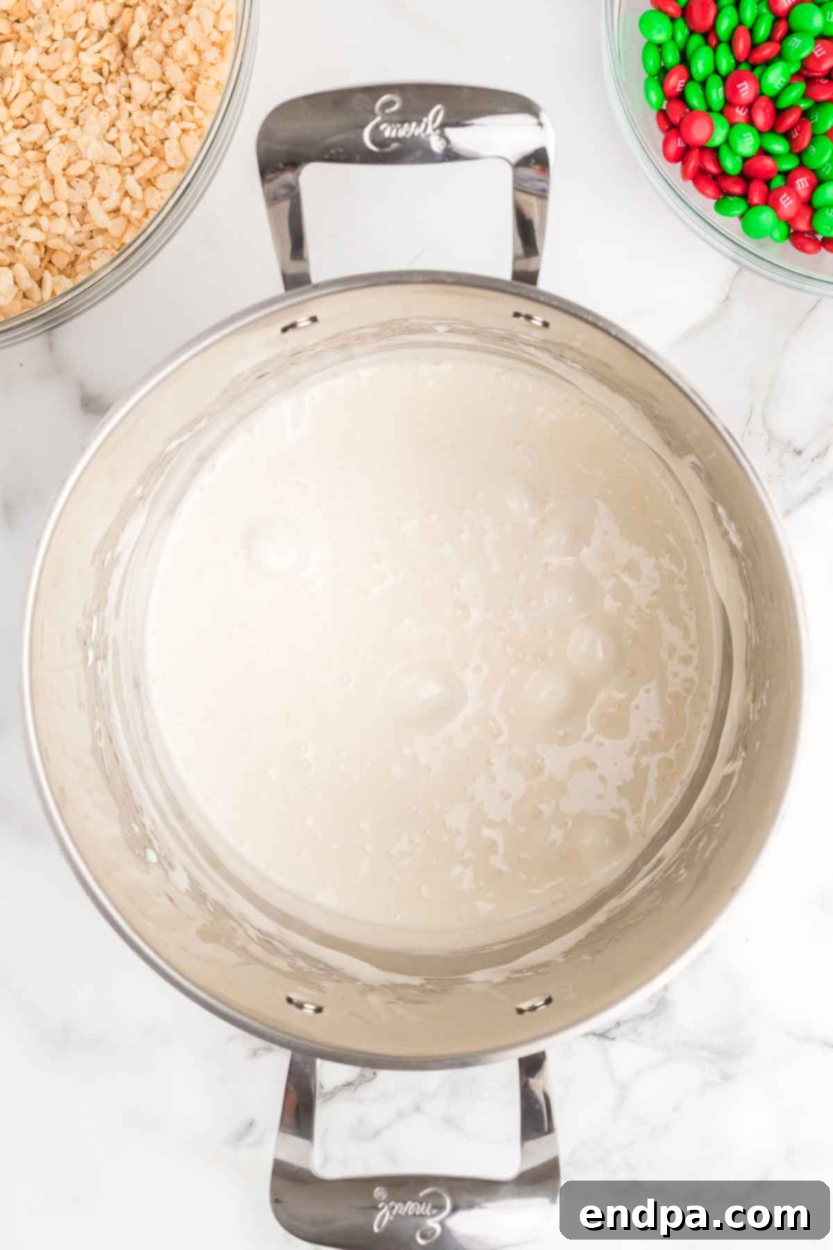 Jolly Krispie Delights 5 The melted marshmallow and butter mixture simmering gently in a saucepan, ready for the cereal.