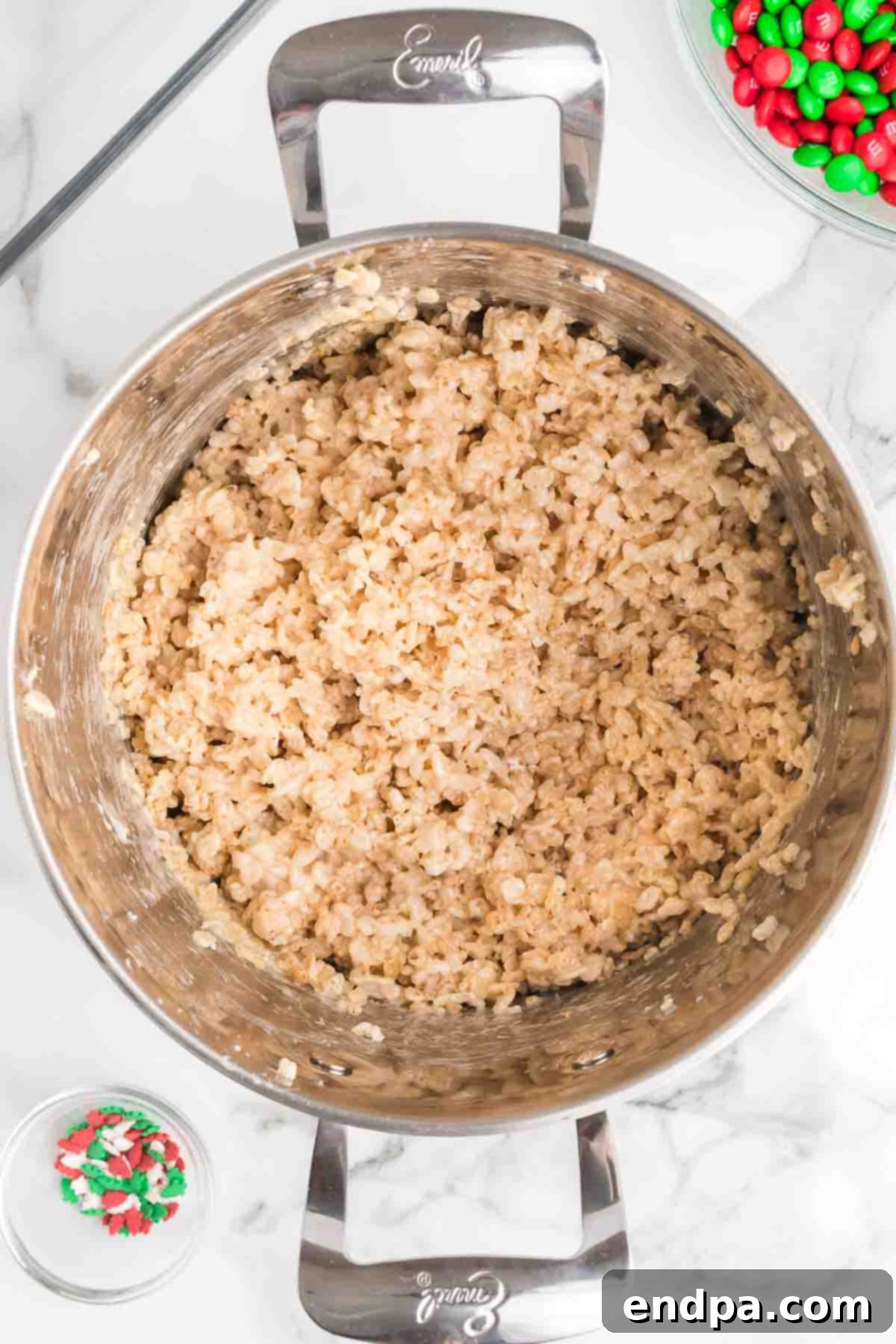 Jolly Krispie Delights 7 The Rice Krispie cereal fully coated in the marshmallow mixture, ready for additional mix-ins.