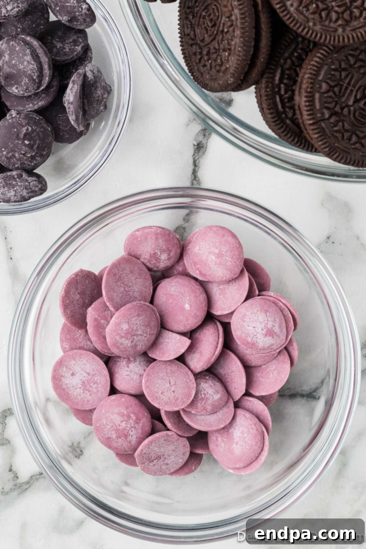 Purple candy melts in a microwave-safe bowl, ready to be melted.