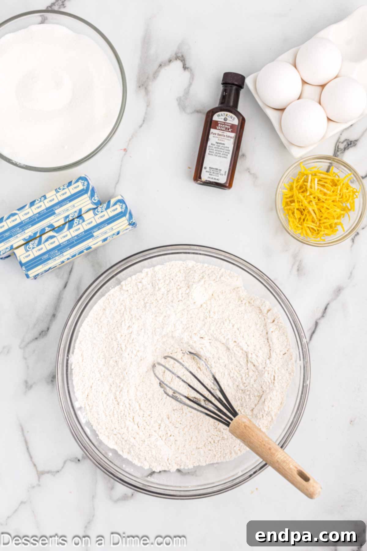 Bowl with dry ingredients combined for lemon cupcakes.