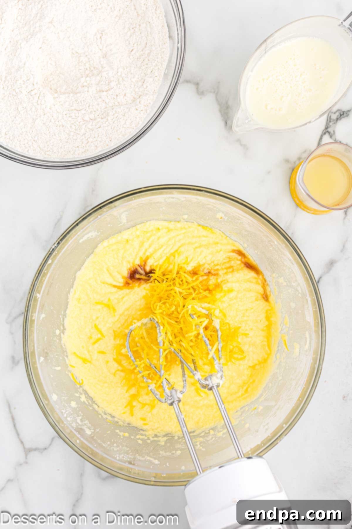 Lemon zest and vanilla extract added to the wet ingredients.