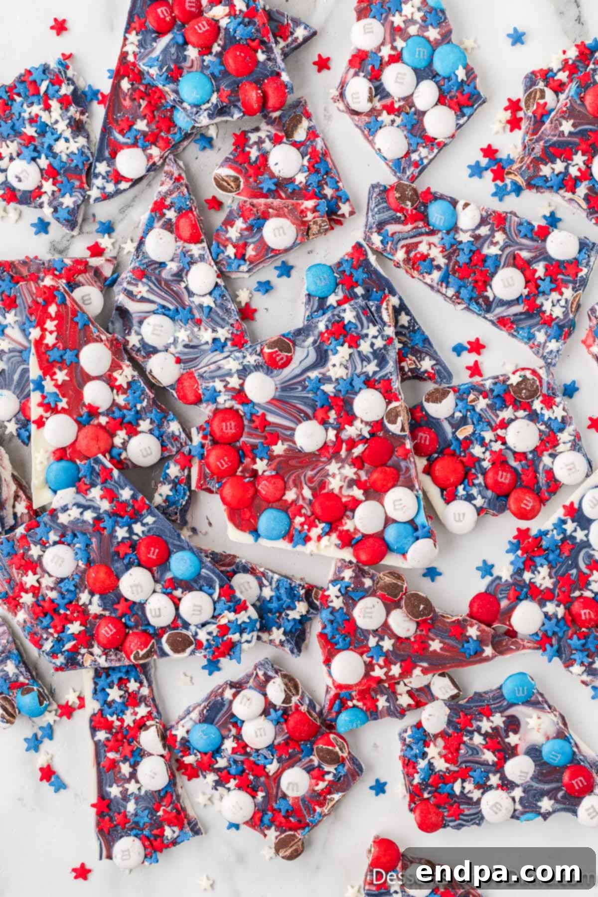 Broken pieces of patriotic bark on a white plate, ready to be served.