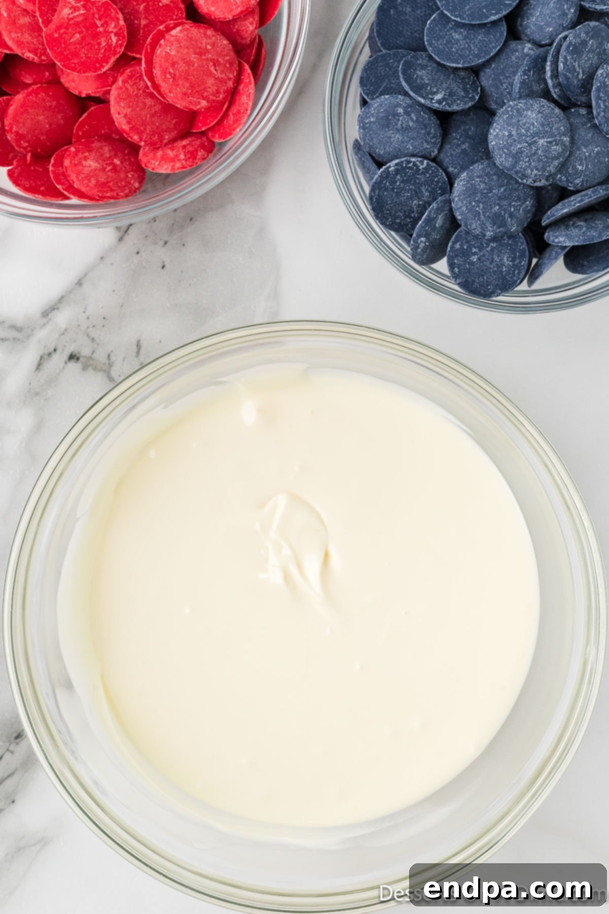 Melted white chocolate in a bowl, smooth and ready to spread.