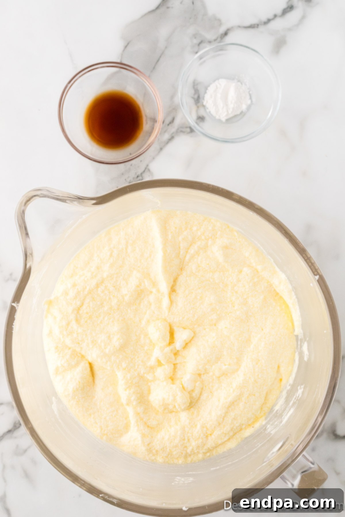 Dreamy Cream Cheese Pound Cake 9 The cream cheese mixture, now enriched with eggs, is thoroughly combined until smooth and uniform, indicating a well-emulsified pound cake batter.