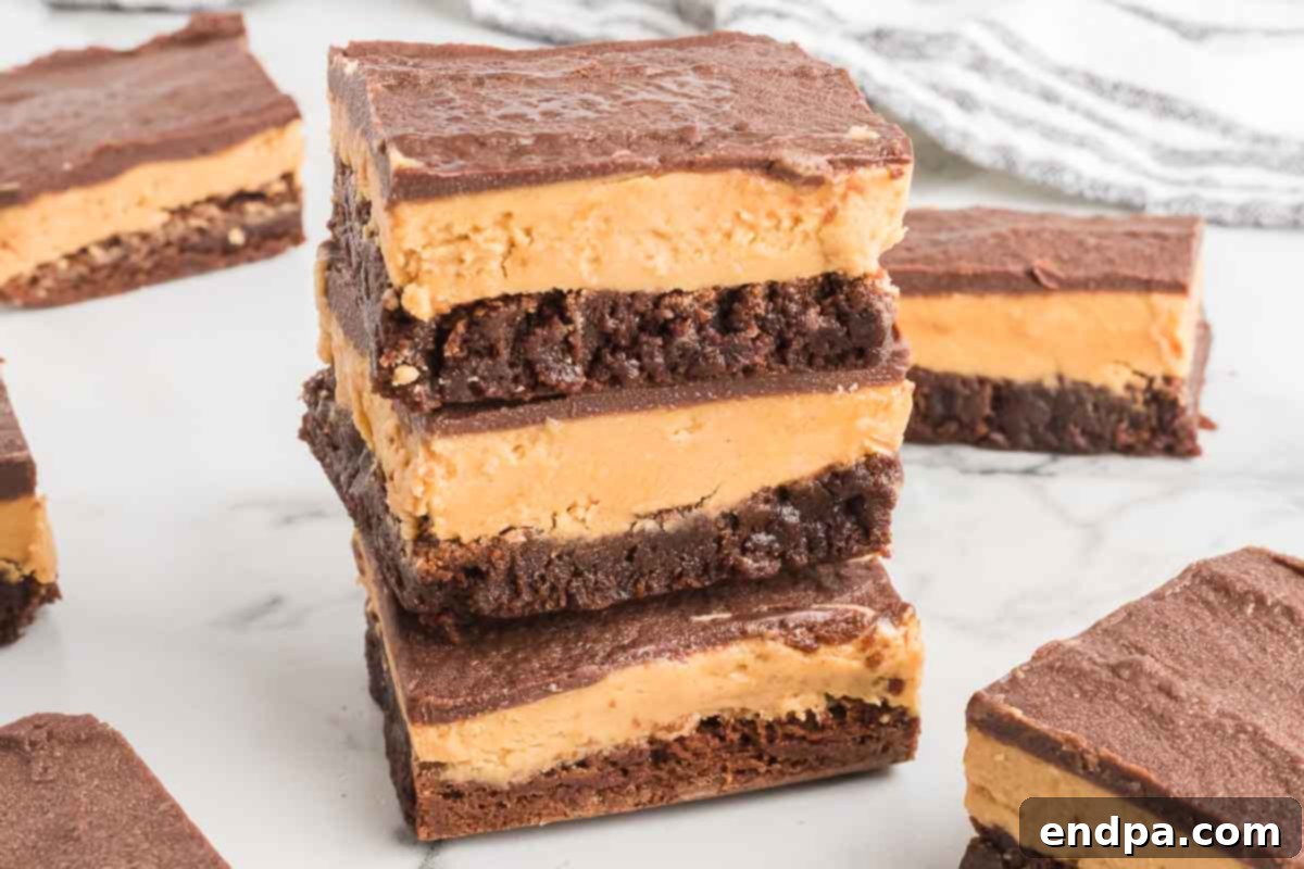 Decadent Chocolate Peanut Butter Buckeye Brownies 2 Buckeye Brownies stacked together.