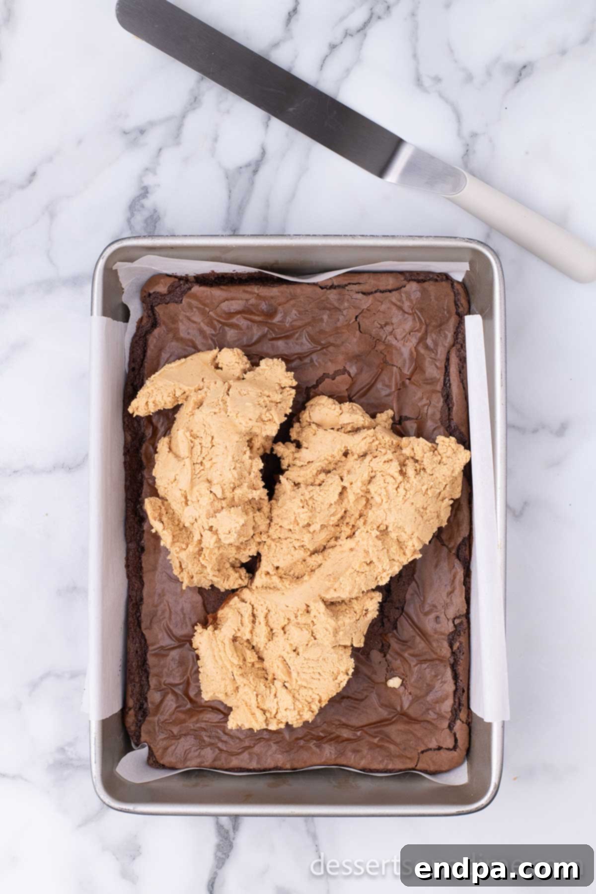 Decadent Chocolate Peanut Butter Buckeye Brownies 8 Peanut butter mixture spread on brownies.