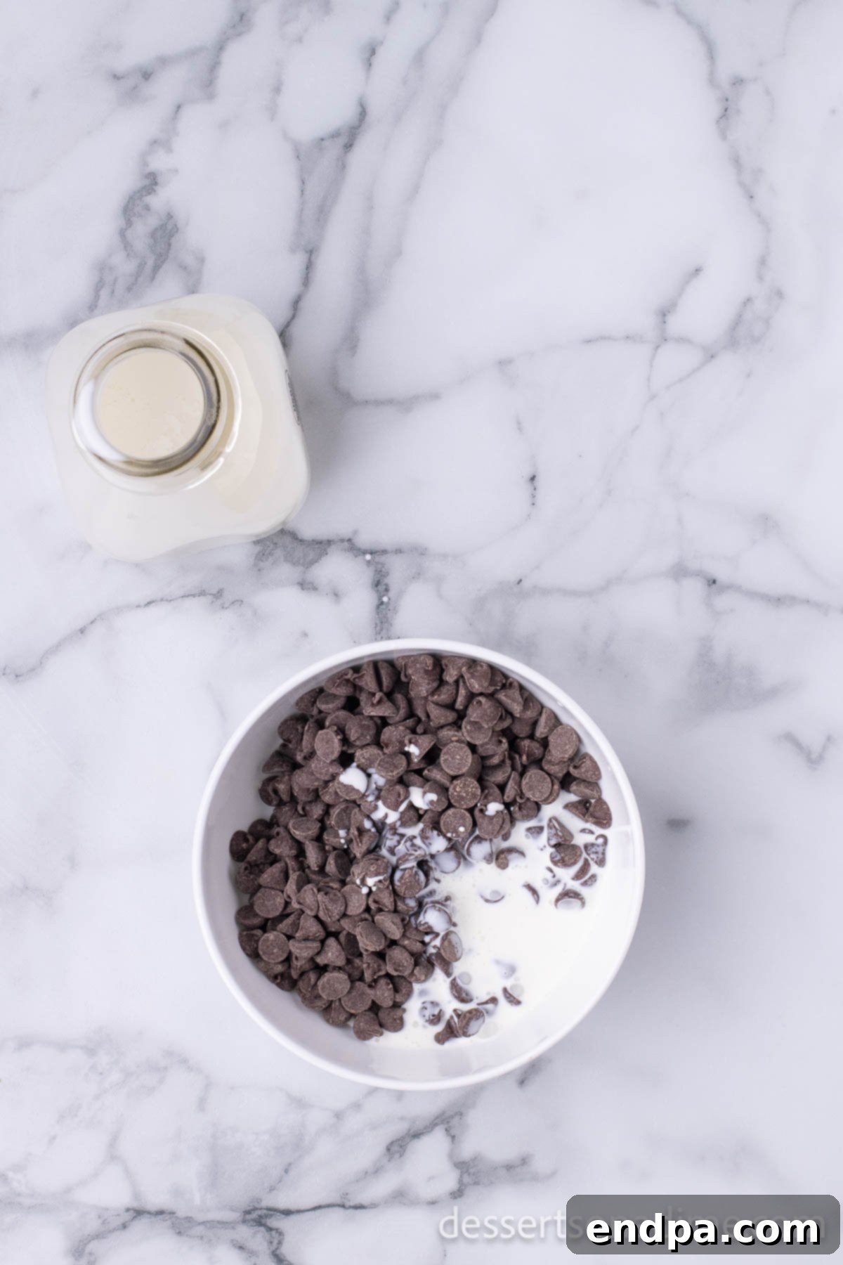 Decadent Chocolate Peanut Butter Buckeye Brownies 10 Chocolate chips and cream in a bowl.