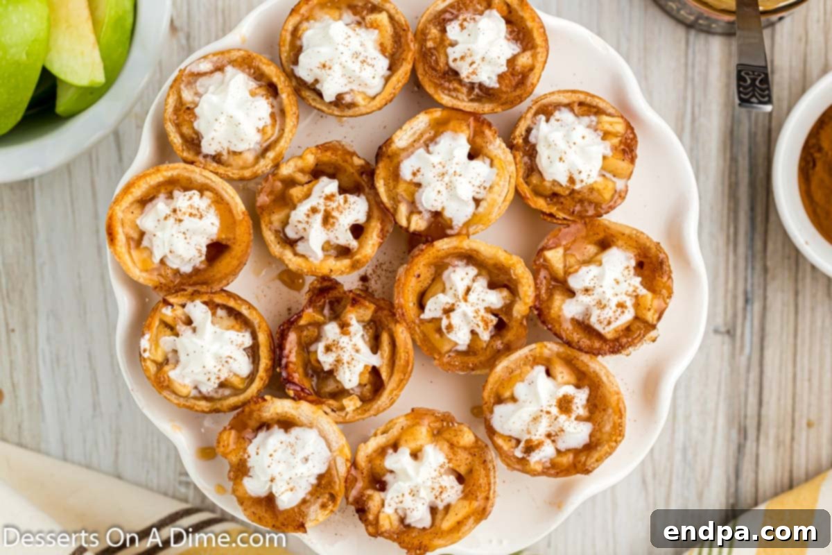 Mini Apple Pie Bites arranged beautifully on a platter, showcasing their golden crust and enticing filling.