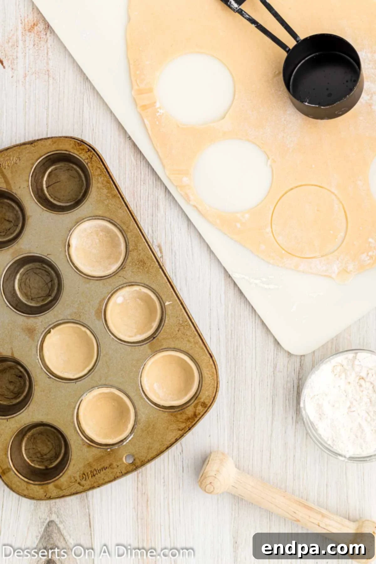 Refrigerated pie dough circles neatly cut out and arranged on a lightly floured surface.