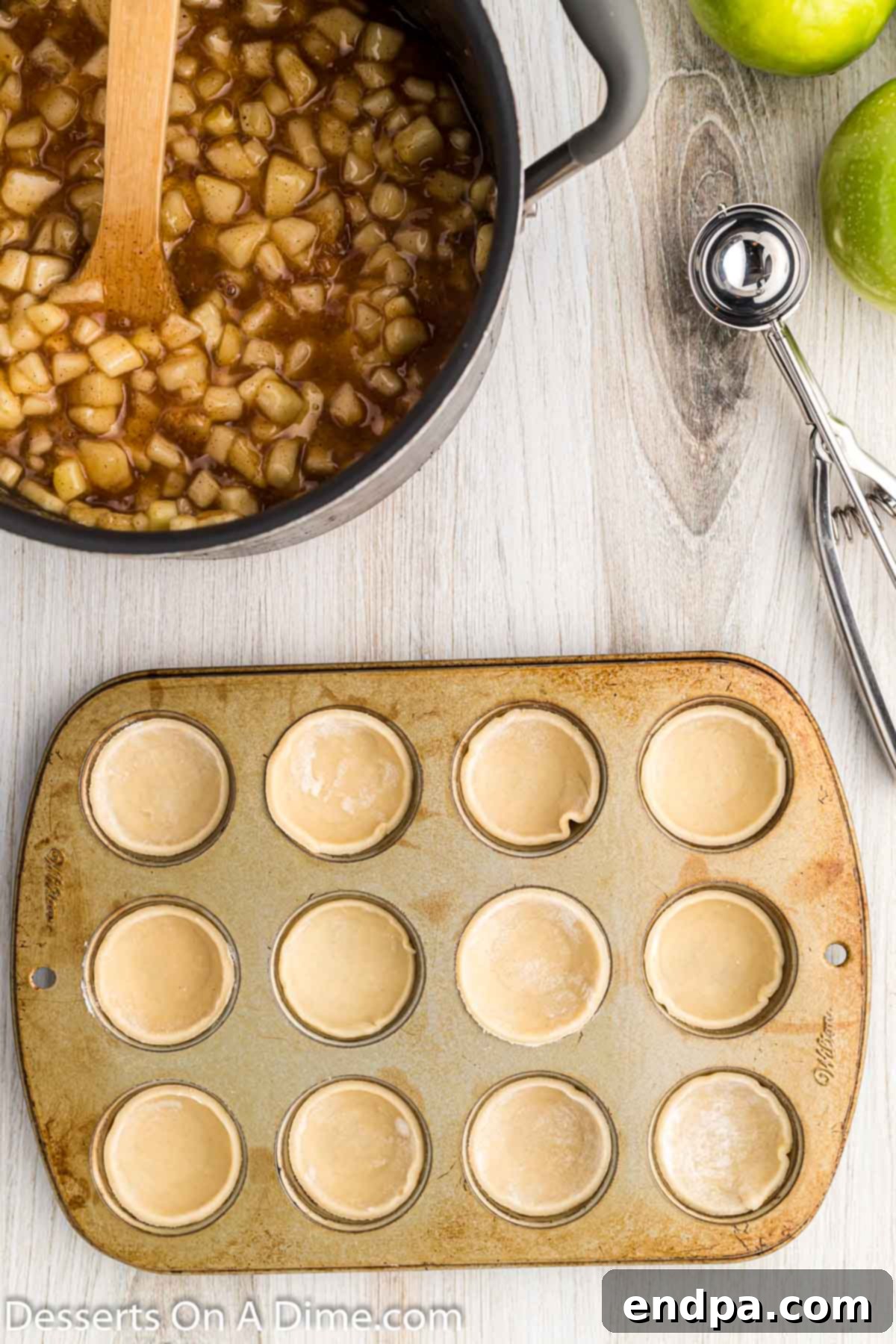 Mini pie crust circles perfectly fitted into the wells of a mini muffin tin.