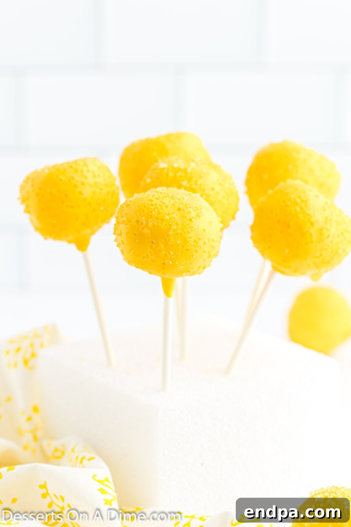 Copycat Starbucks Lemon Cake Pop Recipe 9 Cake Pops in Styrofoam block.