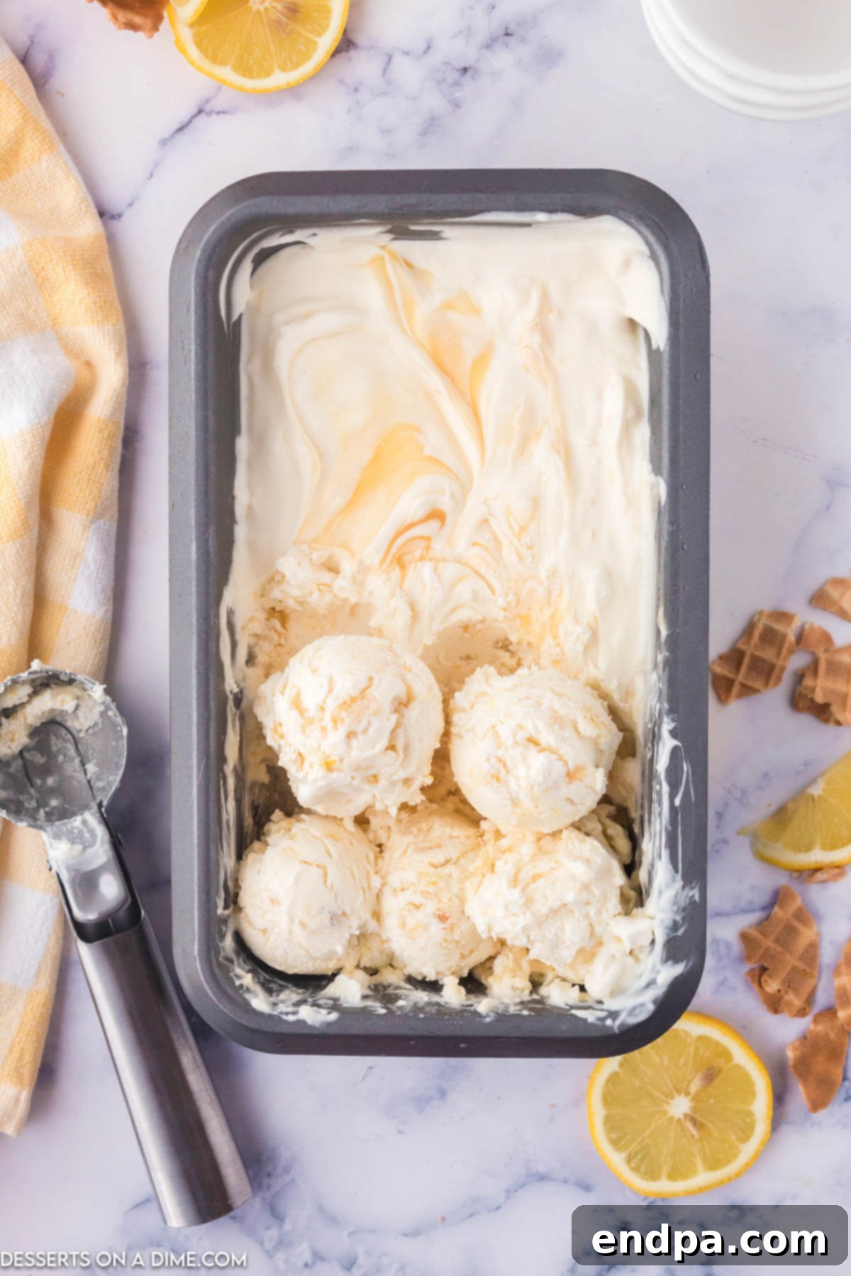 Zesty Shortbread Crumble Ice Cream 2 Container of Lemon Shortbread Ice Cream, showcasing its creamy texture and visible shortbread pieces.
