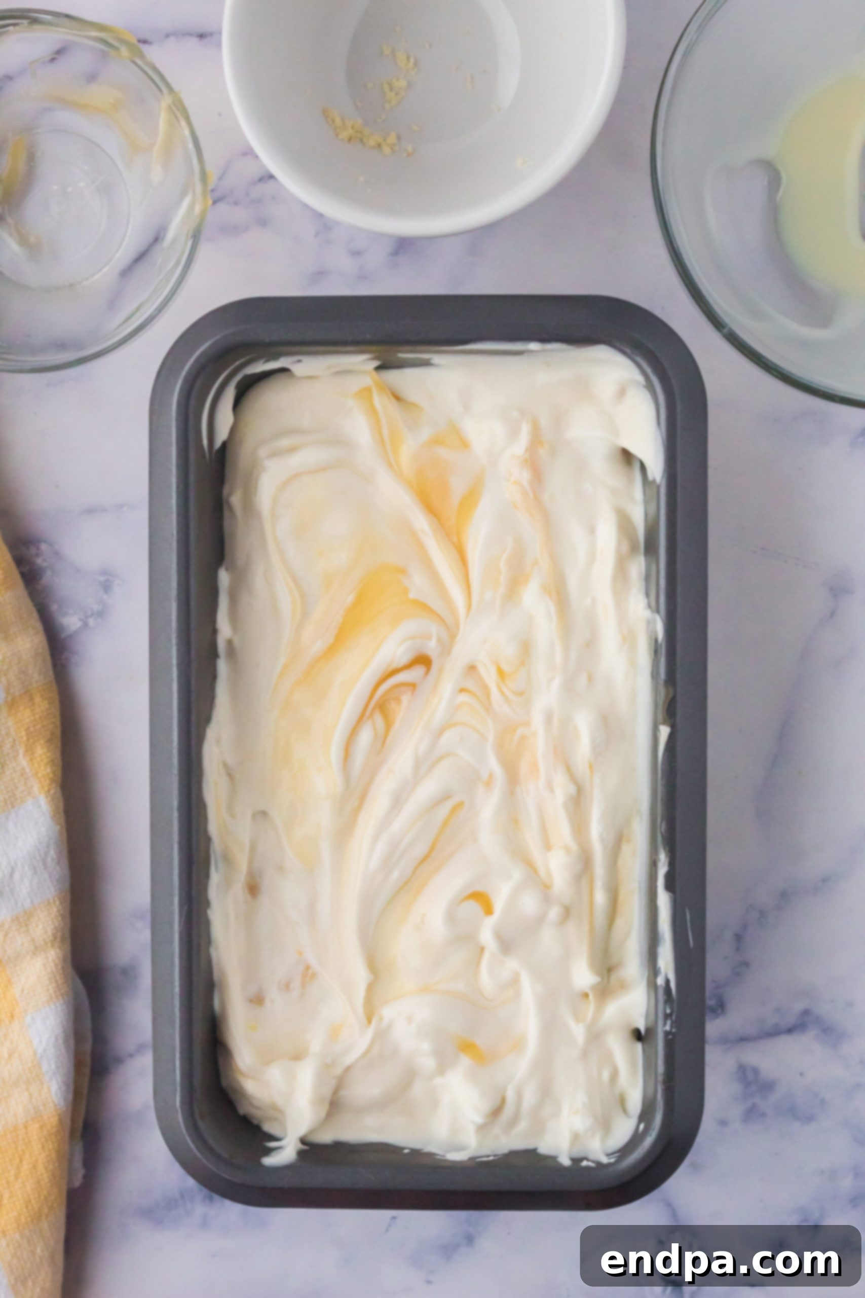 Zesty Shortbread Crumble Ice Cream 6 Ice cream mixture transferred into a metal loaf pan for freezing.