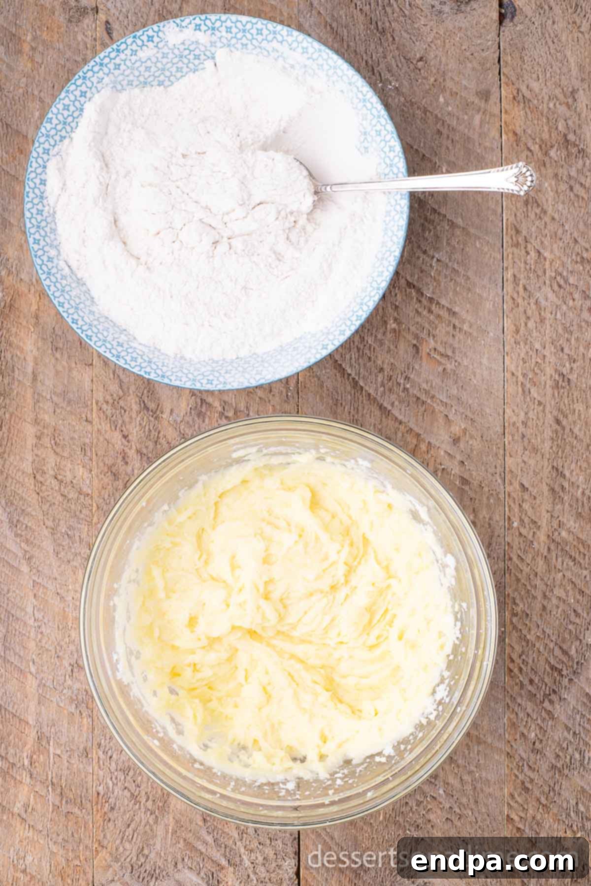 Simple Snickerdoodle Perfection 4 Two mixing bowls, one containing dry ingredients (flour, baking soda, cream of tartar, salt) and the other with creamed wet ingredients.